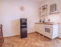 a kitchen with a hard wood floor